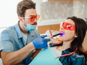 dentist providing Restorative Dental Treatment